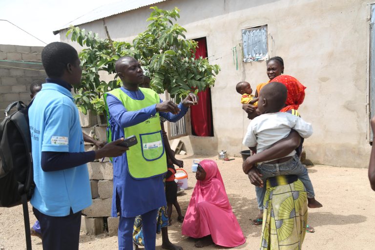 Barsini Mardi sensitizing women during his Wednesday door-to-door routine education outreach