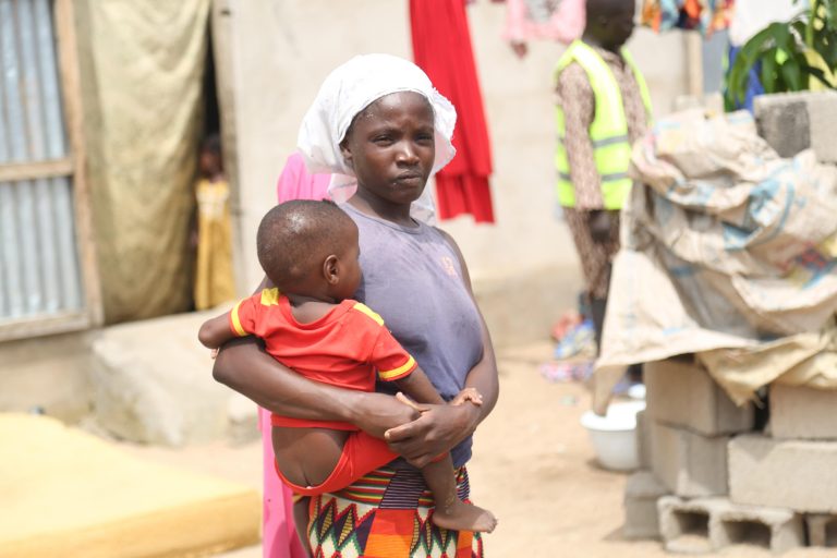 A Fulani woman holding her baby